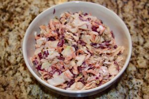 bowl of coleslaw on a counter