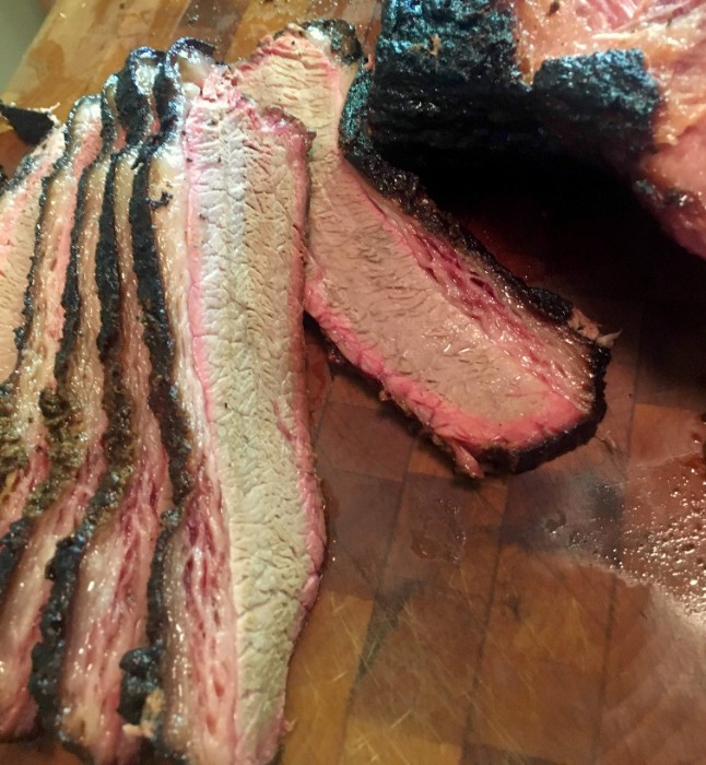 Sliced brisket on a cutting board